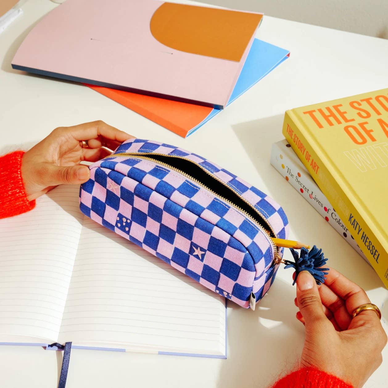 A purple checkerboard pencil case from the Pencil Me In stationery shop.