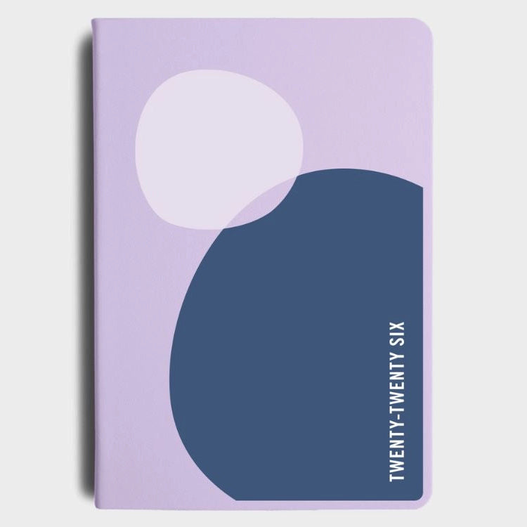 Purple diary with abstract design and 'Twenty-Twenty Six' text on a light gray background