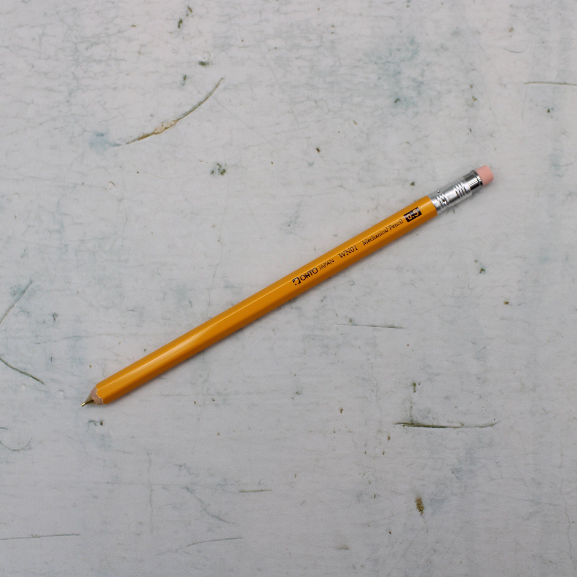 A yellow wooden mechanical pencil from the Pencil Me In stationery shop.