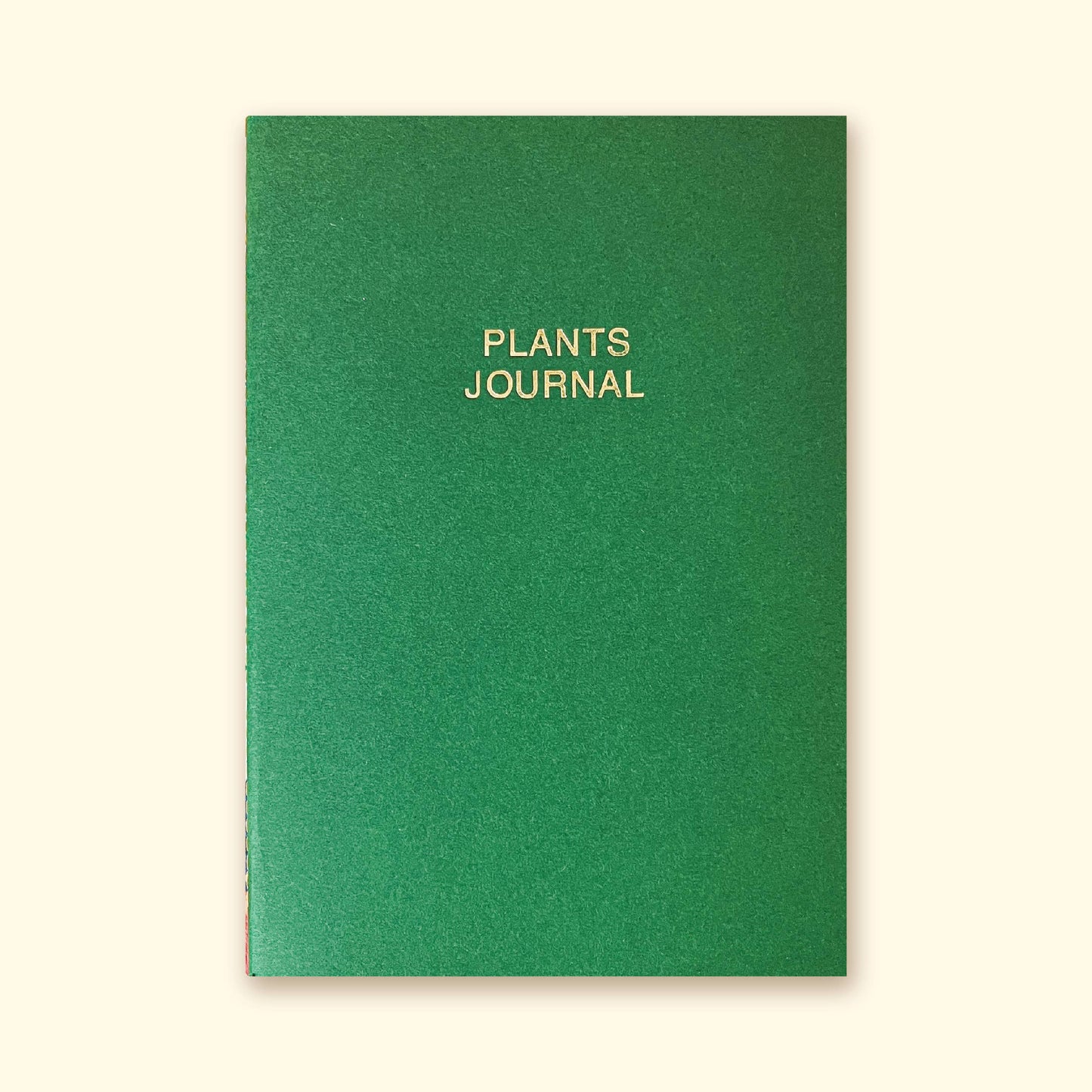 A green Plants Journal with white text on the cover.