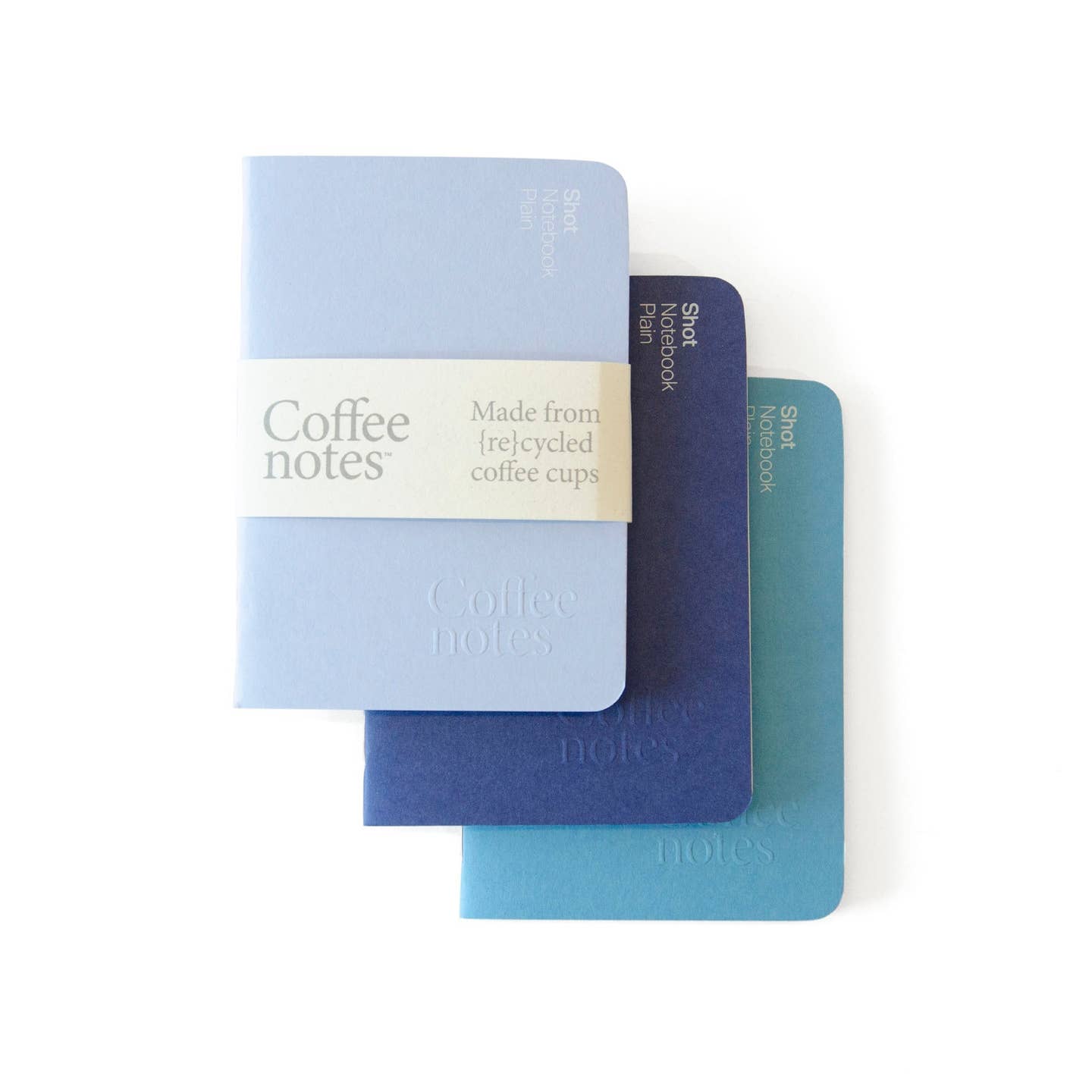 A selection of 3 pocket notebooks in pastel blue, dark blue and blue from the Pencil Me In stationery shop. 