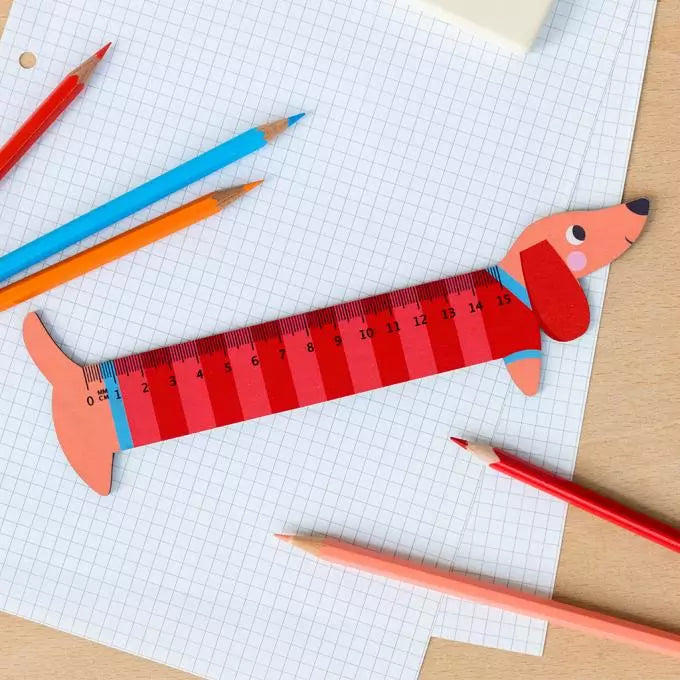 A wooden ruler shaped like a sausage dog from the Pencil Me In stationery shop. 