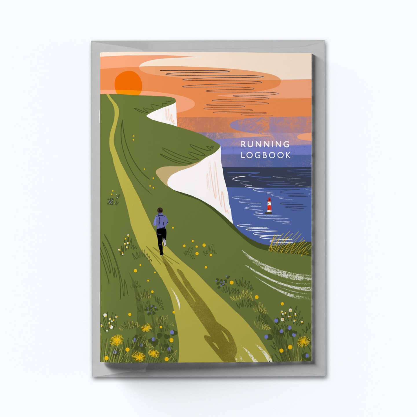 A running logbook cover with a scenic illustration of a person running on a path with a lighthouse in the background from the Pencil Me In stationery shop.