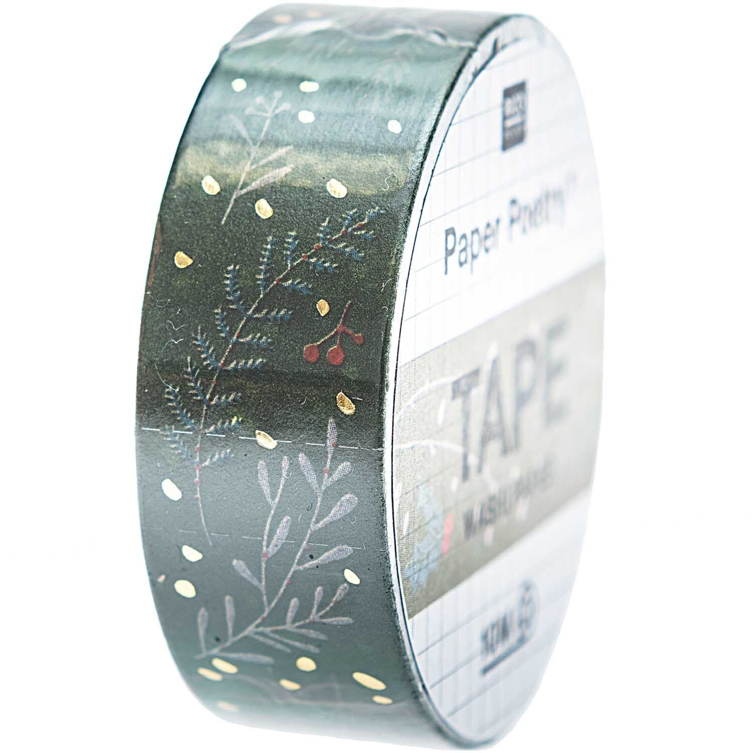 A roll of washi tape featuring festive branches from the Pencil Me In stationery shop. 