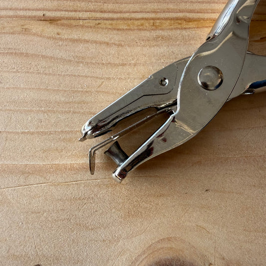 Multi-use hole punch