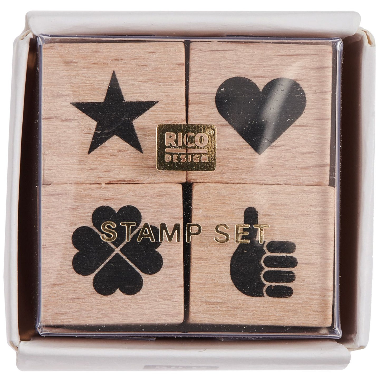 A set of four wooden stamps with star, heart, clover, and hand symbols in a box from the Pencil Me In stationery shop. 