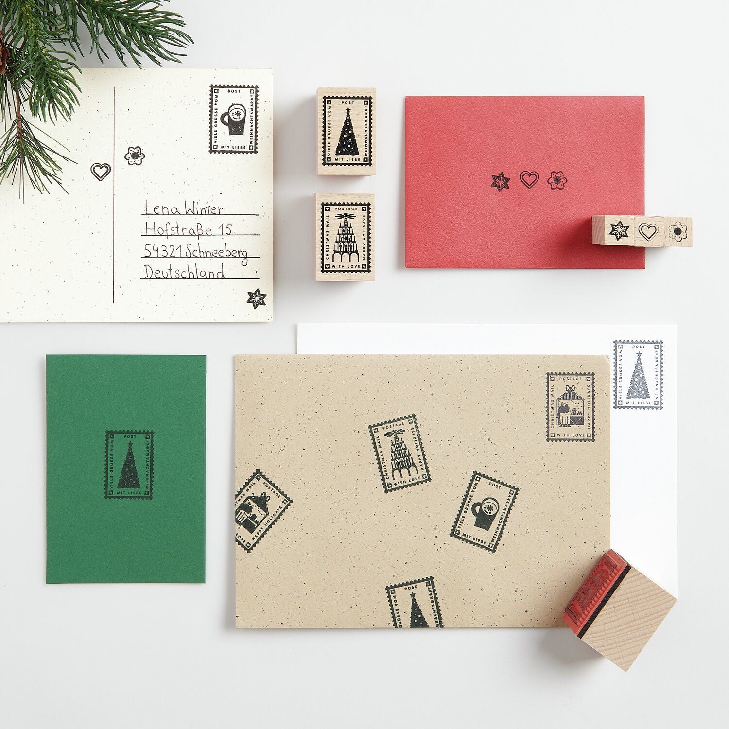 A selection of Christmas stamps with a black ink pad from the Pencil Me In stationery shop.