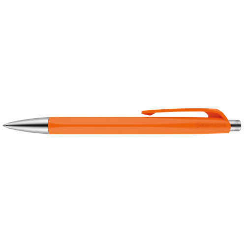 A orange Caran d'Ache 888 Infinite pen available from the Pencil Me In stationery shop. 