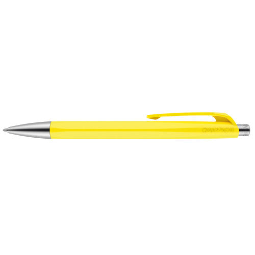 A lemon yellow Caran d'Ache 888 Infinite pen available from the Pencil Me In stationery shop. 