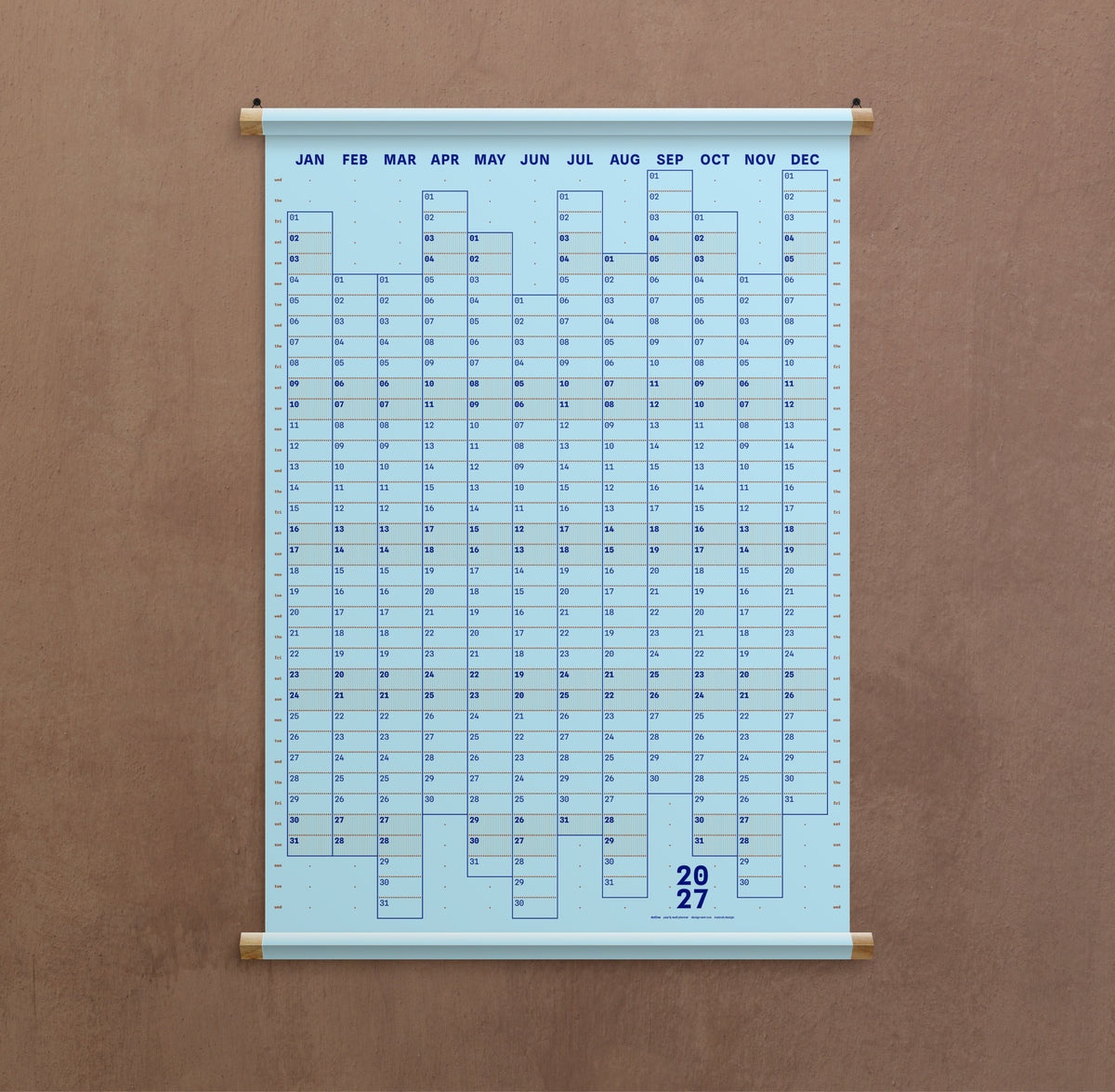A light blue hanging calendar showing the months of the year in a grid format. Available from the Pencil Me In stationery shop. 
