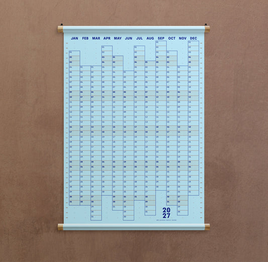 A light blue hanging calendar showing the months of the year in a grid format. Available from the Pencil Me In stationery shop. 