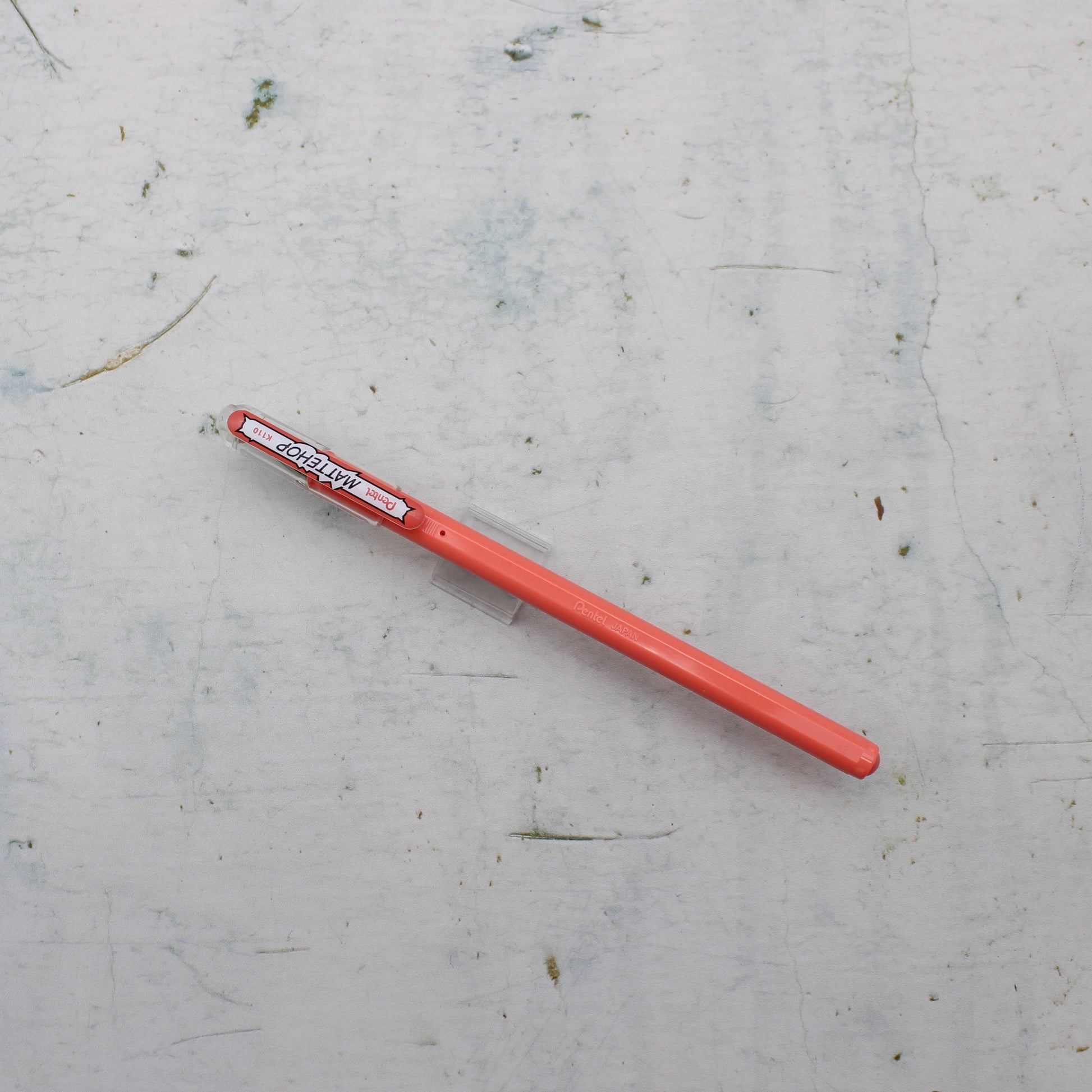 A coral pentel mattehop pen from the Pencil Me In stationery shop.