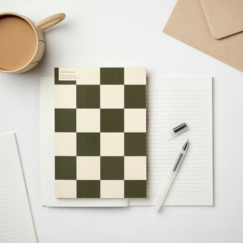 A checkerboard notebook from the Pencil Me In stationery shop.