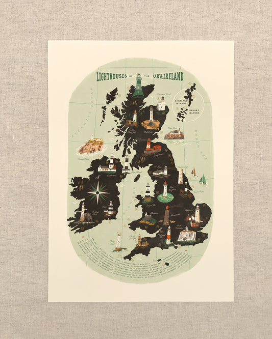 A vertical art print of a stylized map of the United Kingdom and Ireland, featuring a dark silhouette of the landmass with illustrated lighthouses, ships, and coastal details on a pale green background, displayed against a textured light gray linen backdrop.