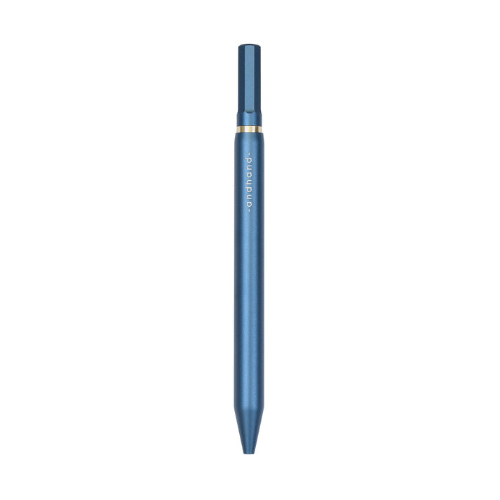 A blue pen with gold accents from the Pencil Me In stationery shop.