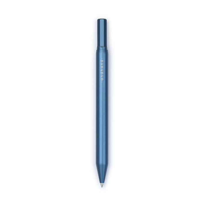 A blue pen with gold accents from the Pencil Me In stationery shop.