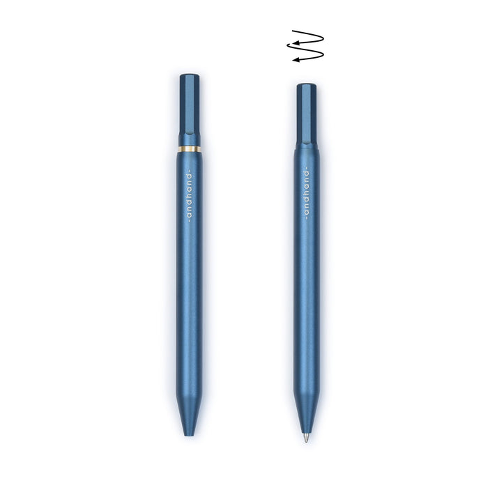 A blue pen with gold accents from the Pencil Me In stationery shop.