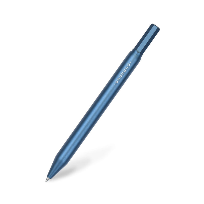 A blue pen with gold accents from the Pencil Me In stationery shop.