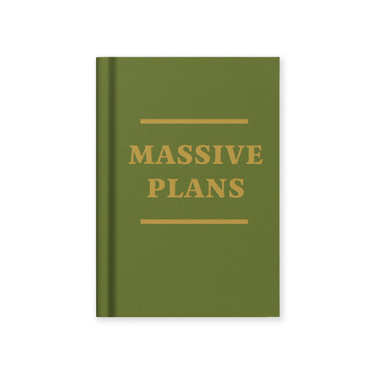 A Green book with 'MASSIVE PLANS' text in gold foil from the Pencil Me In stationery shop.