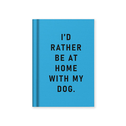 A Blue notebook with text 'I'd rather be at home with my dog' from the Pencil Me In stationery shop. 
