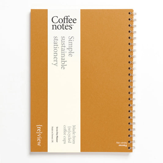 A mustard yellow weekly planner from the Pencil Me In stationery shop. 
