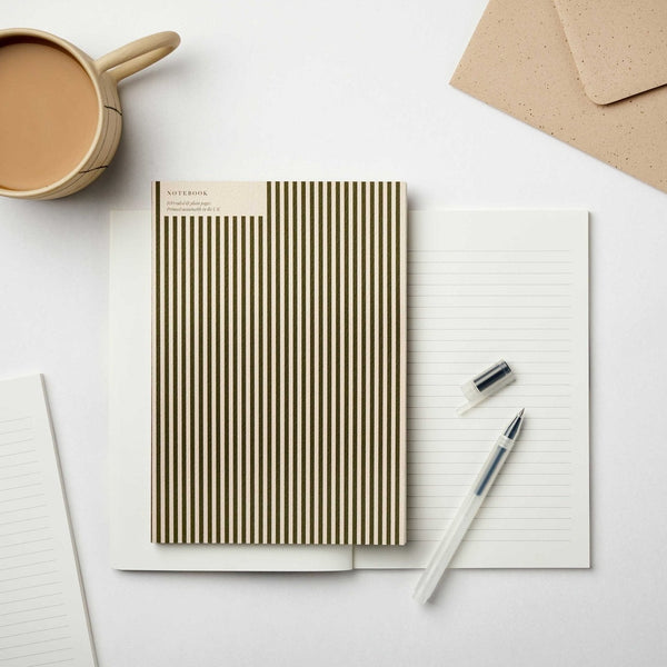 A striped notebook from the Pencil Me In stationery shop.