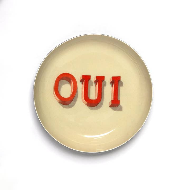 A 'Oui' enamel tray from the Pencil Me In stationery shop. 