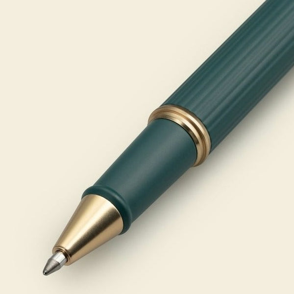 A teal rollerball pen from the Pencil Me In stationery shop.