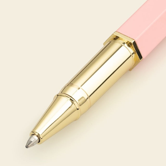 A pink rollerball pen from the Pencil Me In stationery shop.