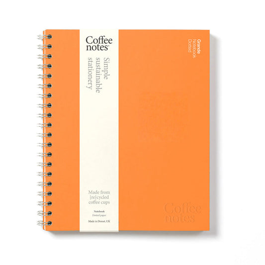 A bright orange notebook from Pencil Me In stationery shop. 