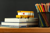A colourful School Bus toy from the Pencil Me In stationery shop