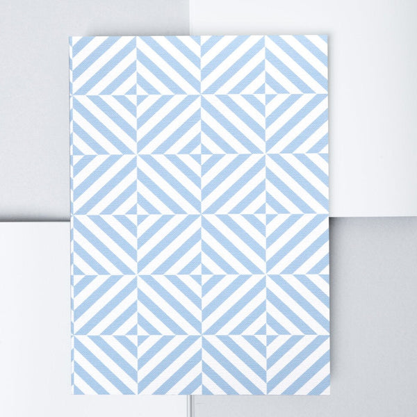 A blue flat lay notebook from the Pencil Me In stationery shop